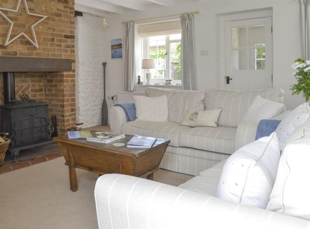 Spacious living room with feature fireplace at Mill House in Docking, near Hunstanton, Norfolk