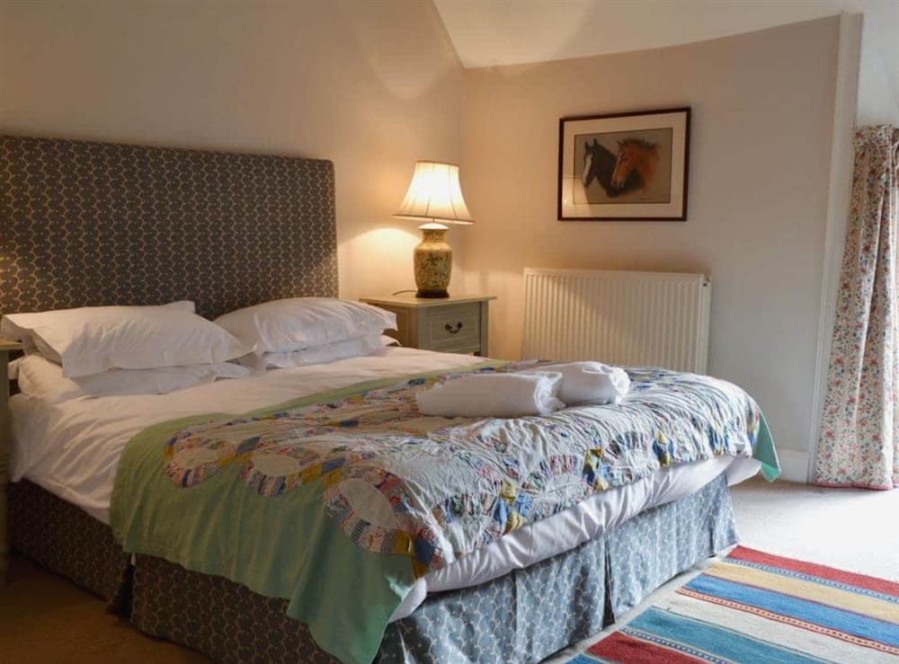 Bedroom with kingsize bed at Mill House in Rievaulx, near Helmsley, North Yorkshire