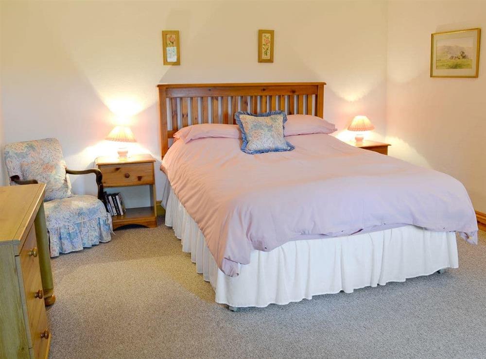 King size bedroom at Mill Moor Cottage in Pooley Bridge, Cumbria