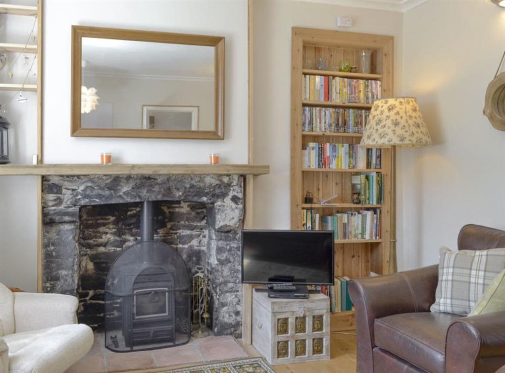 Stylish living room with wood burner at Mill Street in Drummore, near Stranraer, Dumfries and Galloway, Wigtownshire