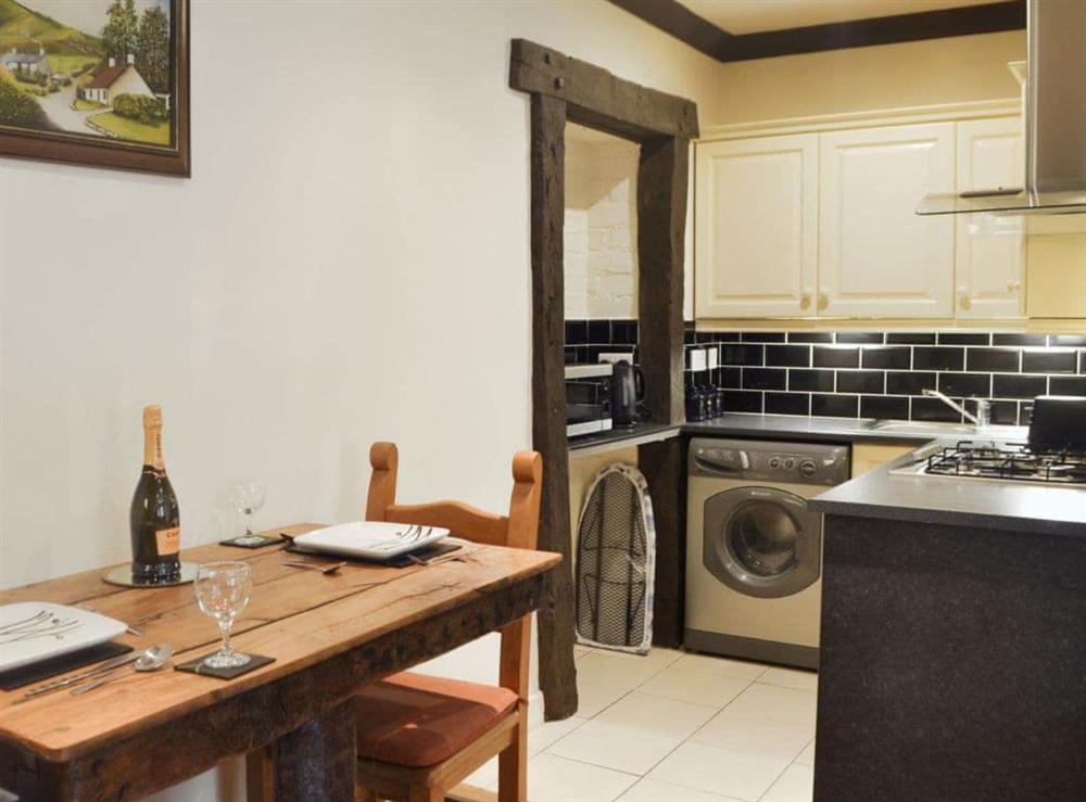 Charming dining area leading into the kitchen at Mill Wheel Cottage in Glenmidge, near Dumfries, Dumfries & Galloway, Dumfriesshire