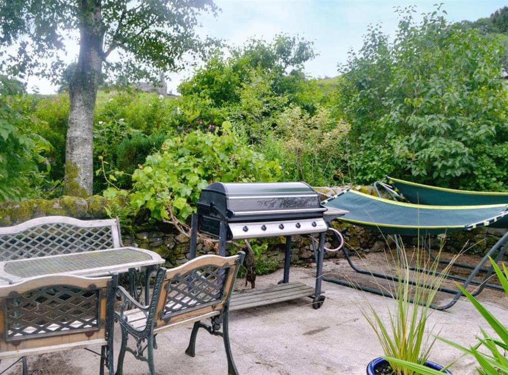 Sitting-out area, garden furniture and BBQ at Mill Wheel Cottage in Glenmidge, near Dumfries, Dumfries & Galloway, Dumfriesshire