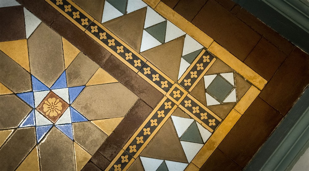 Restored tiles in the entrance hall of Millbeck Towers, Cumbria at Millbeck Towers in Keswick, Cumbria
