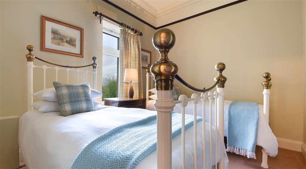 The first floor twin bedroom, which interlinks with the double bedroom with en-suite bathroom at Millbeck Towers in Keswick, Cumbria