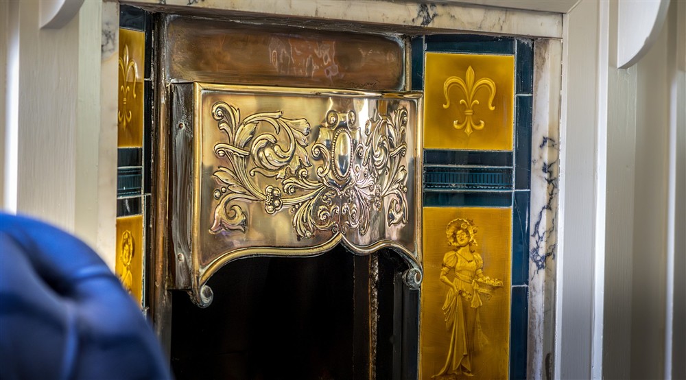 The original fireplace in the sitting room at Millbeck Towers in Keswick, Cumbria