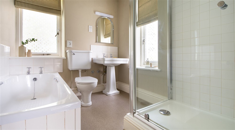 The second floor en-suite bathroom with freestanding bath and walk-in shower at Millbeck Towers in Keswick, Cumbria
