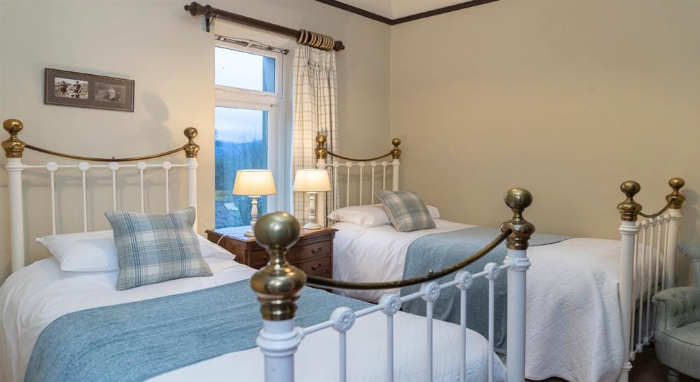 The twin bedroom on the first floor at Millbeck Towers in Keswick, Cumbria