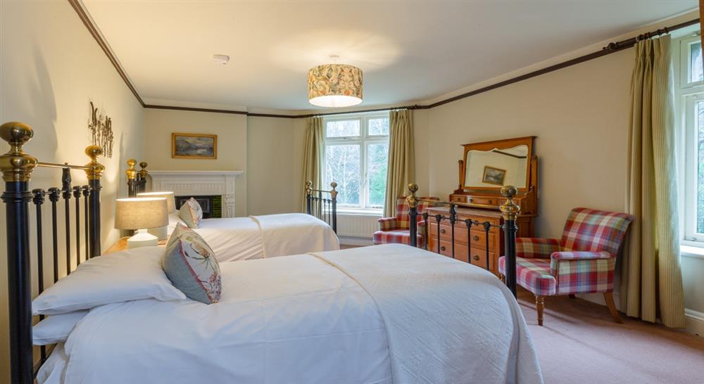 The twin bedroom on the top floor at Millbeck Towers in Keswick, Cumbria