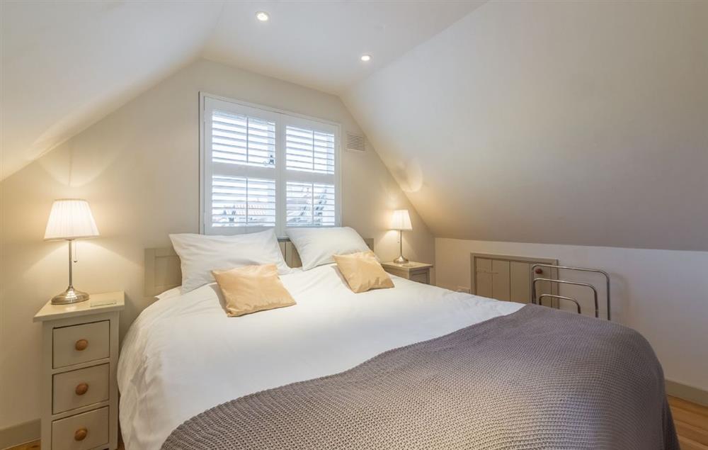 Double bedroom with 6’ bed (which can be 2 x 3’ beds) with en-suite shower room at Millers Loft, Erpingham