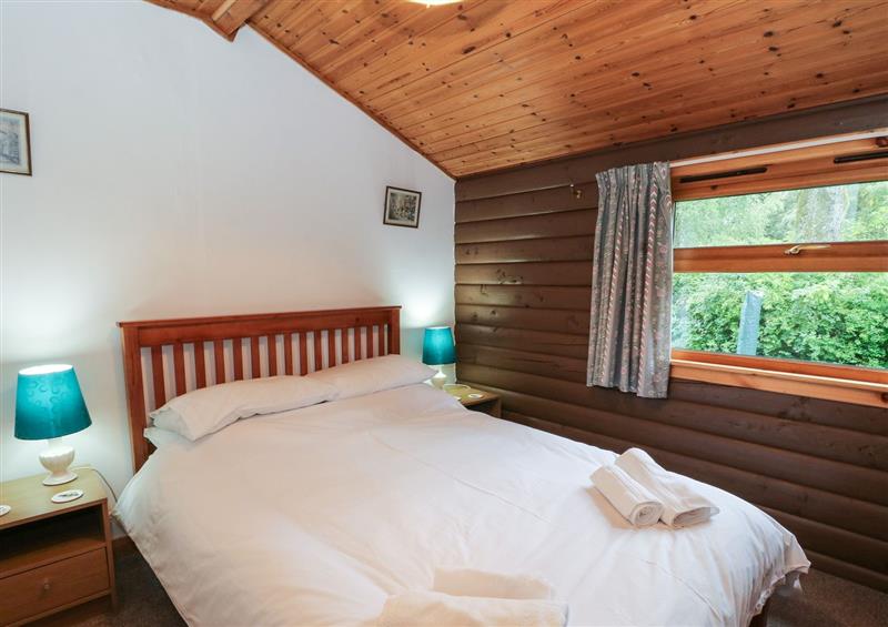 A bedroom in Millmore Cabin at Millmore Cabin, Killin