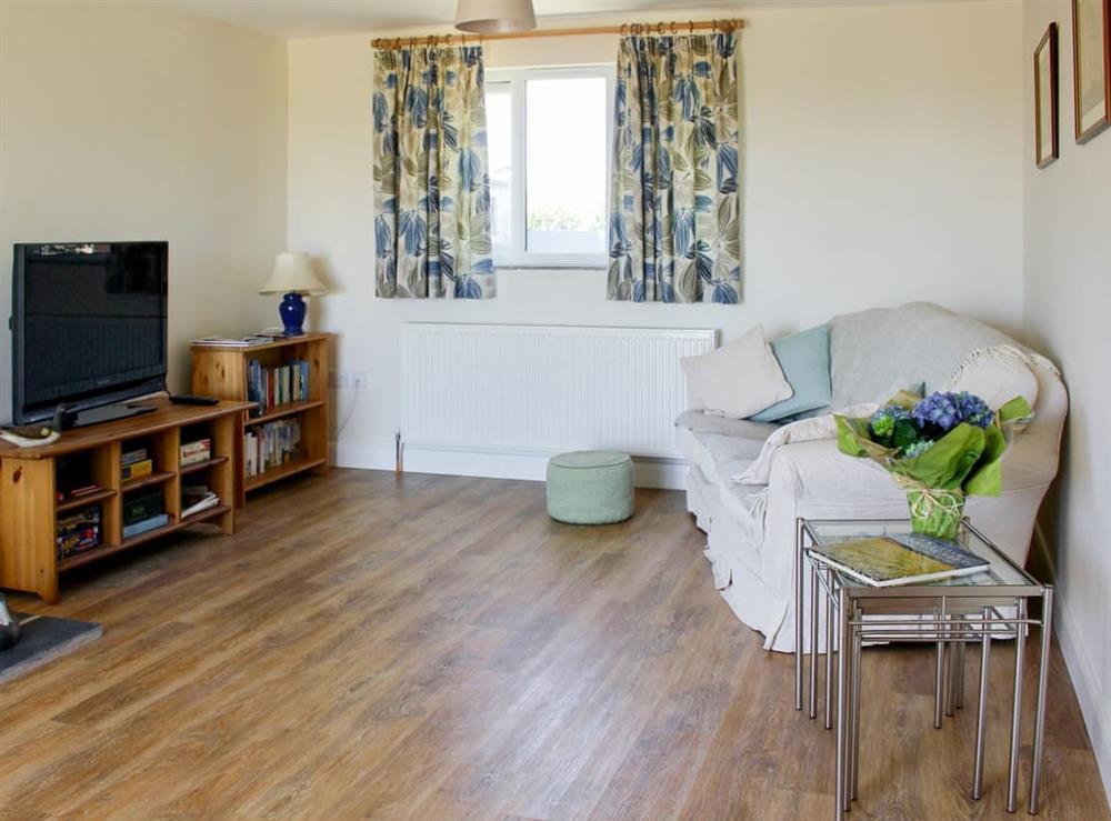 Welcoming living room at Millstone Barn in Priddy, near Wells, Somerset