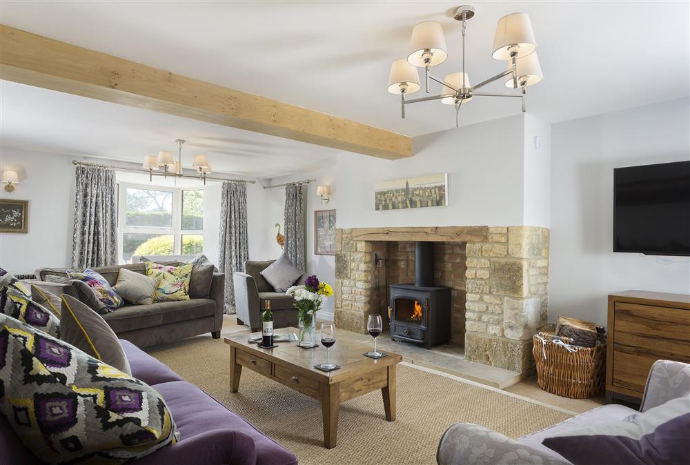 Spacious sitting room with wood burning stove