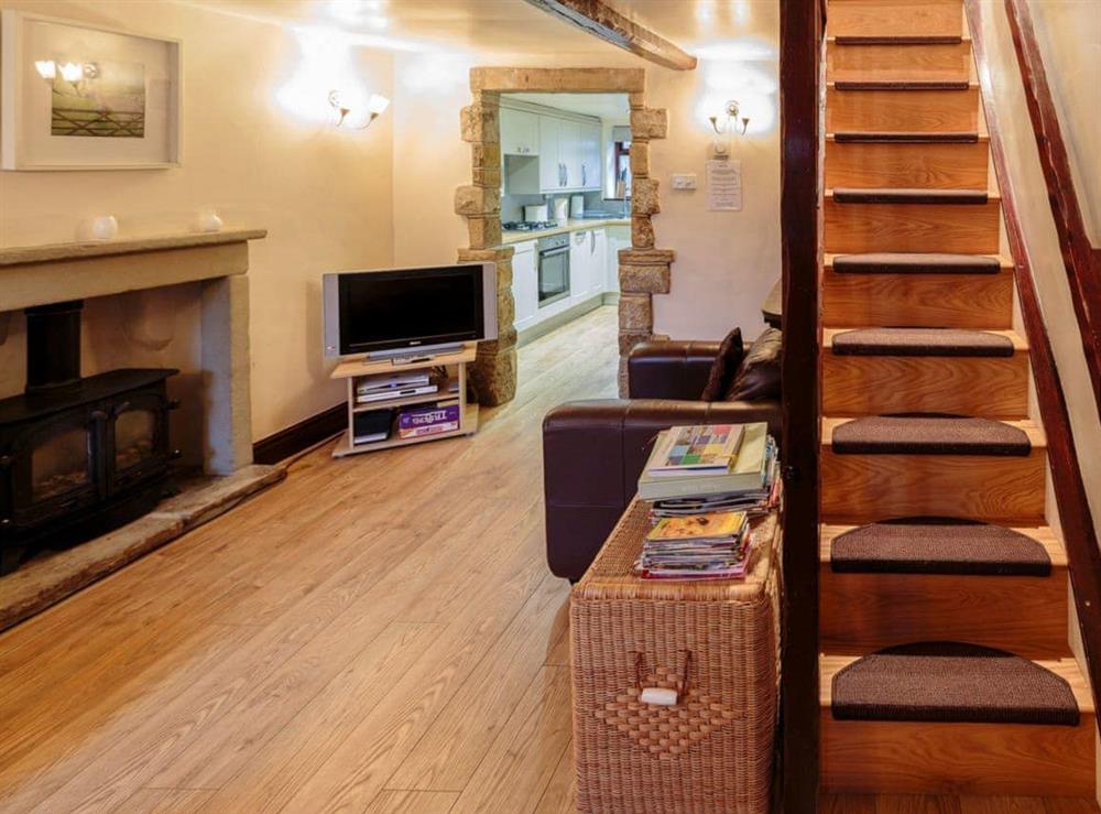 Living room and stairs at Millstone Cottage in Bradwell, South Yorkshire