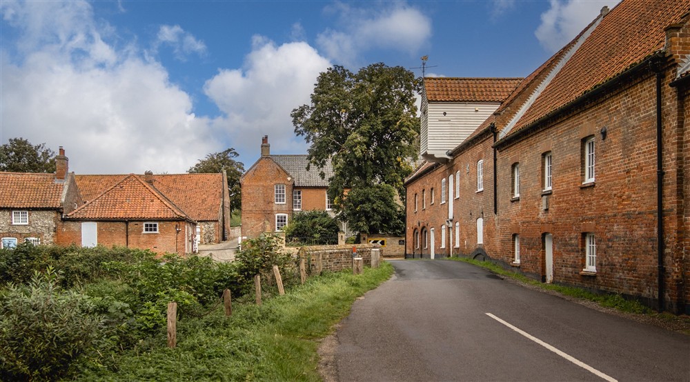 The converted watermill overlooking the mill pool at Millstream in Burnham-overy-staithe, Norfolk