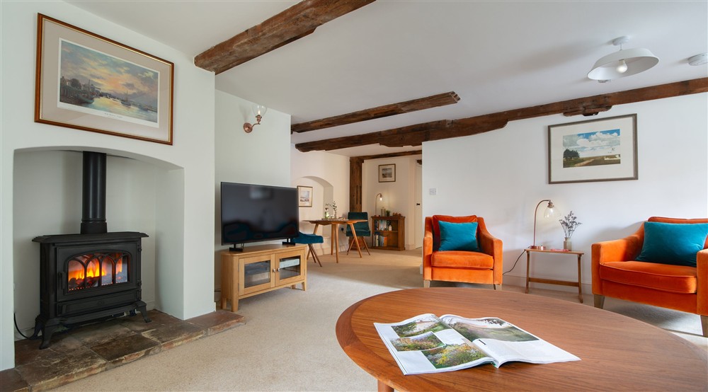 The multi-fuel stove in the open-plan room at Millstream in Burnham-overy-staithe, Norfolk