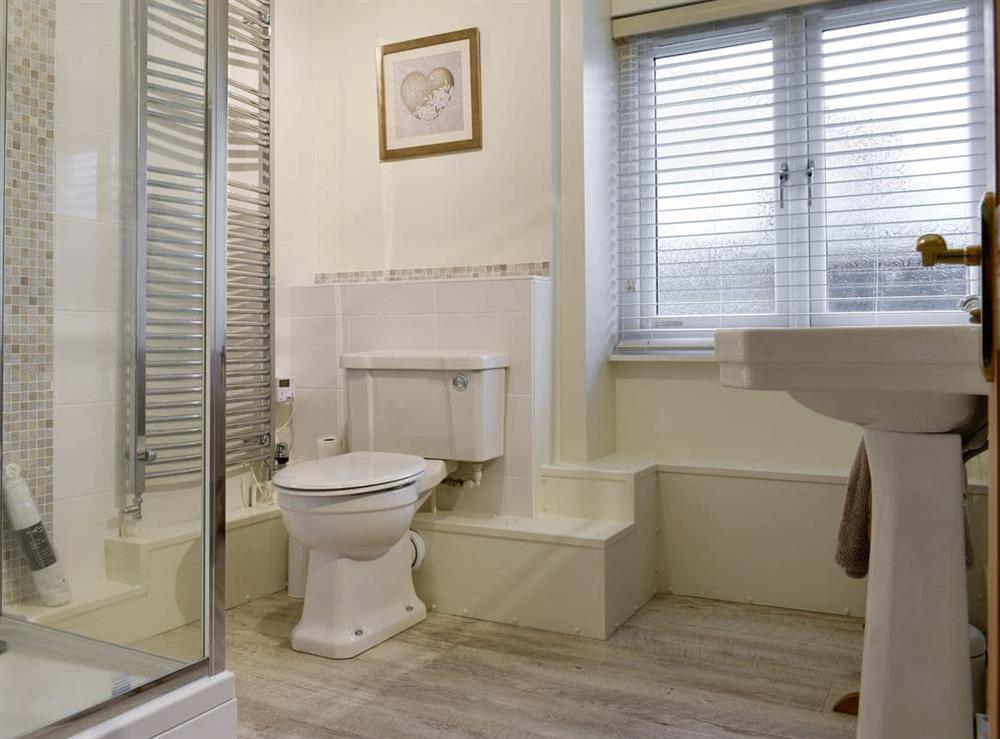 Shower room with heated towel rail at Millys Nook in St Austell, Cornwall