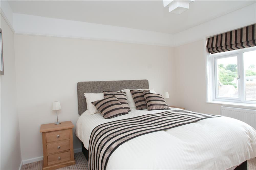 Master bedroom with King-size bed at Miloran in , Salcombe