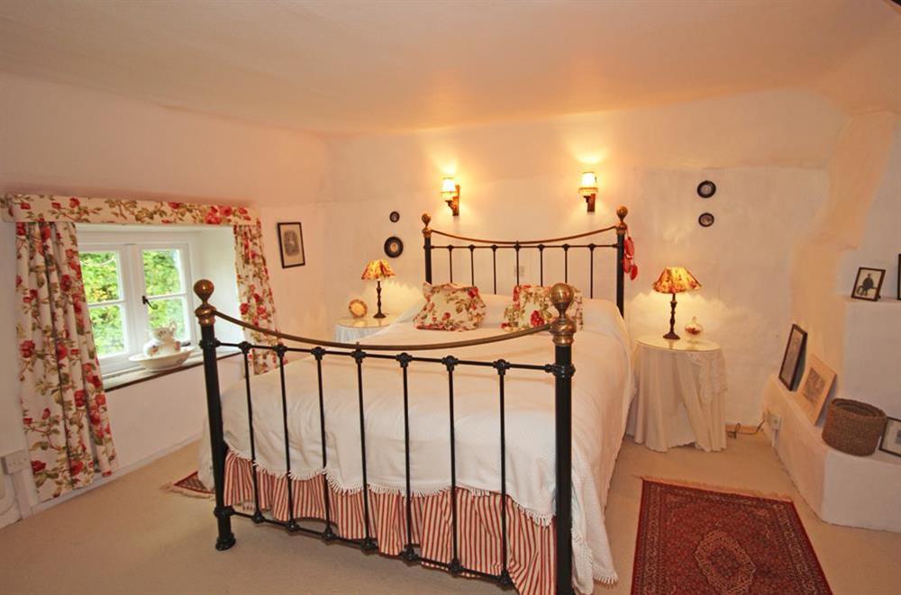 Master bedroom with King-size bed at Milton Cottage in South Milton, Nr Kingsbridge