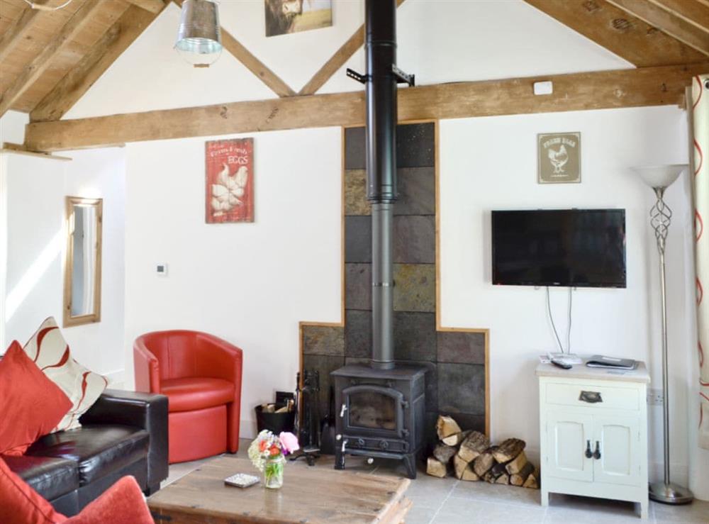 Living area with exposed wooden beams at The Old Parlour, 