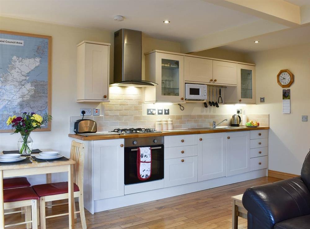 Lovely kitchen and dining areas at River Cottage, 
