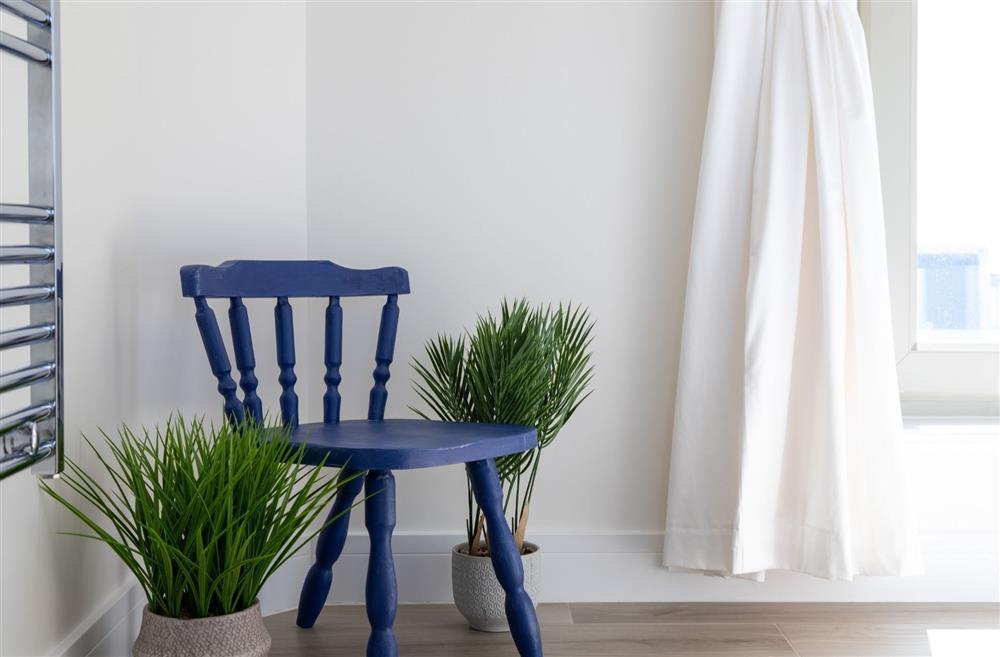 A blue wooden chair