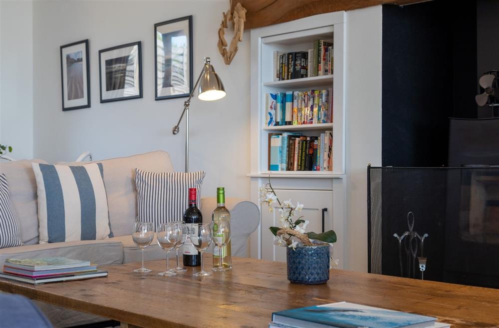 A coffee table with bottled of wine