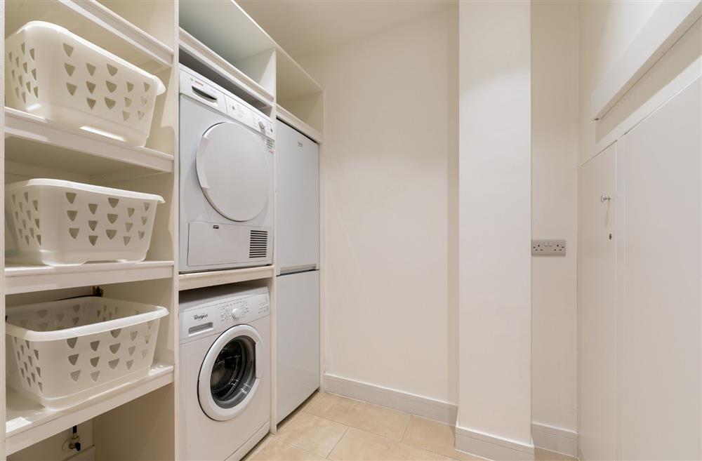 The utility room with washing machine and dryer