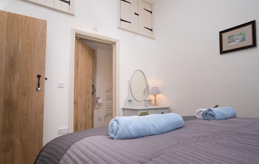 The bedroom benefits from an en-suite shower room at Minafon, Colwyn Bay
