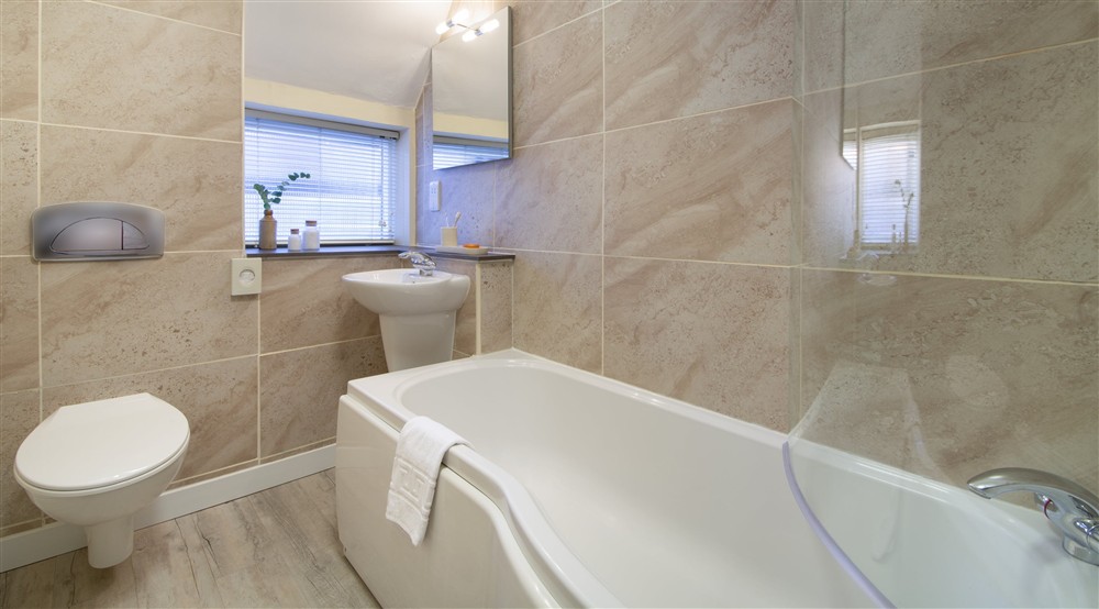 The bathroom with shower over bath at Minstergate in York, North Yorkshire