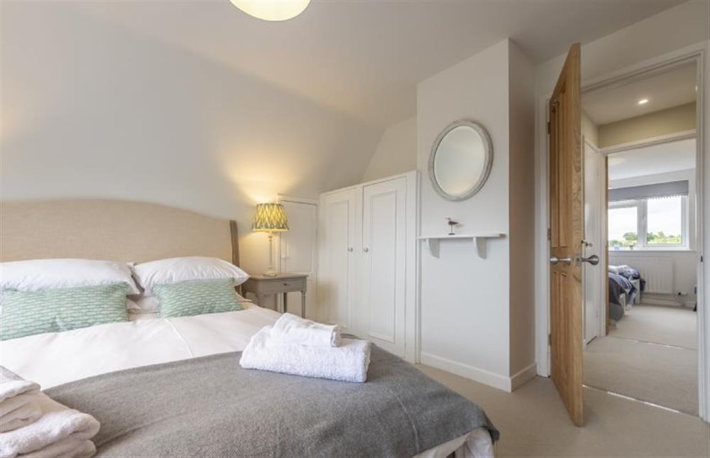 Master bedroom with King-size bed (photo 2) at Miramare Cottage, Holme-next-the-Sea near Hunstanton