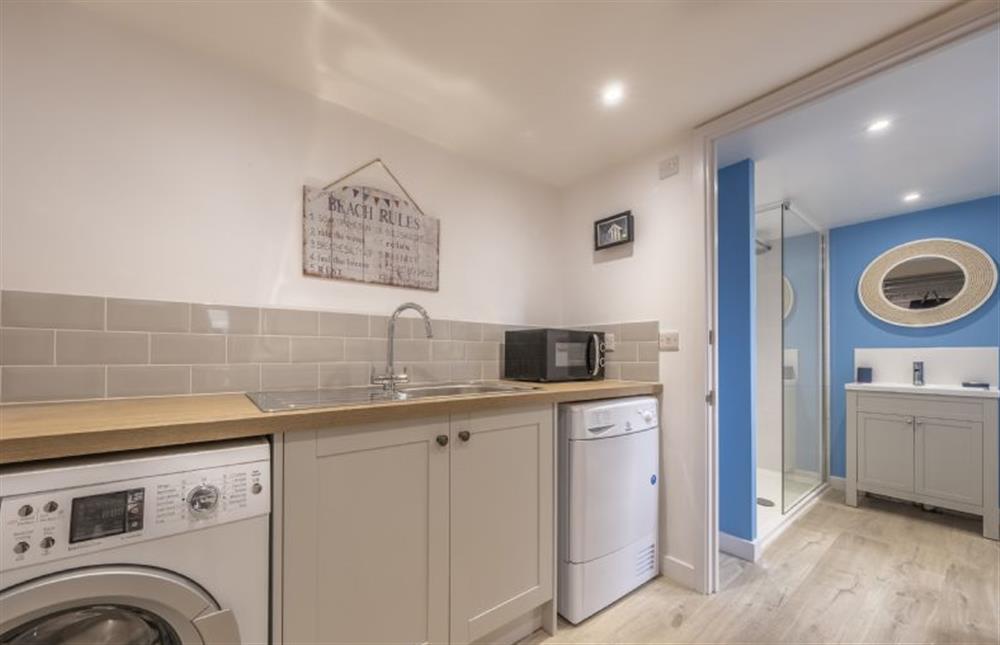 Utility room with washing machine and tumble dryer at Miramare Cottage, Holme-next-the-Sea near Hunstanton