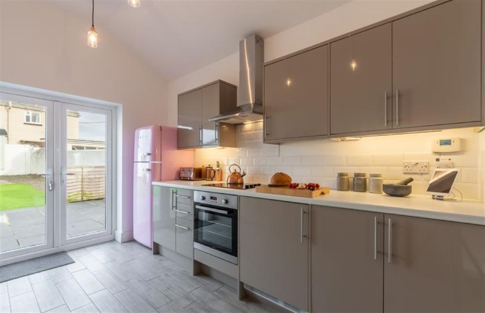 Modern kitchen with french doors to garden at Miss Fishers, Port Isaac