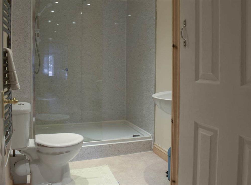 Large shower cubicle within shower room at Moby Dick Cottage in Whitby, North Yorkshire