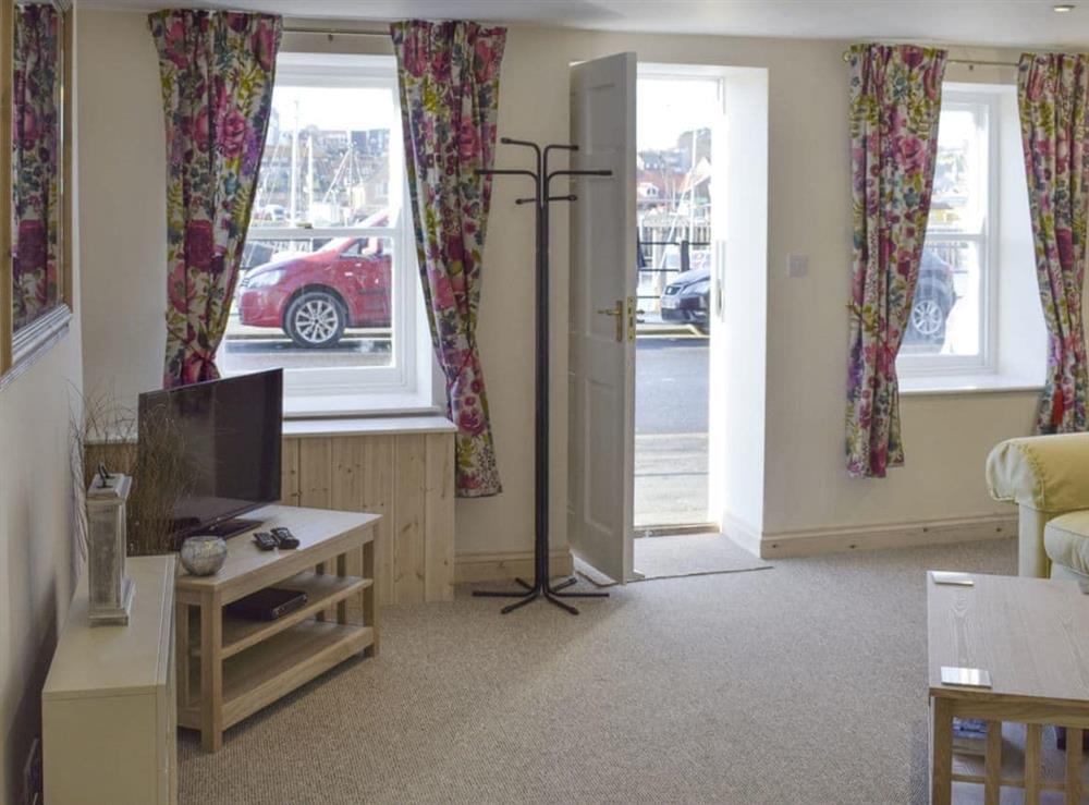 Spacious living room situated across from the waterfront at Moby Dick Cottage in Whitby, North Yorkshire