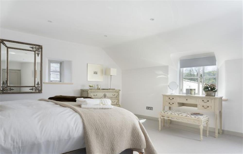 Master bedroom with 5’ double bed (photo 2) at Mole End Cottage, North Cerney