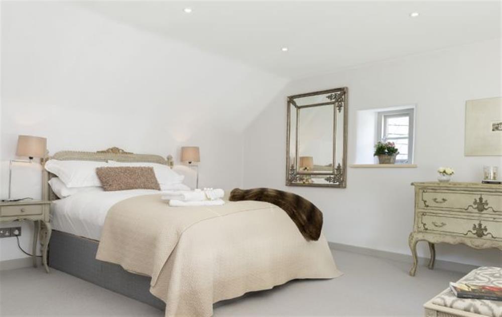 Master bedroom with 5’ double bed at Mole End Cottage, North Cerney