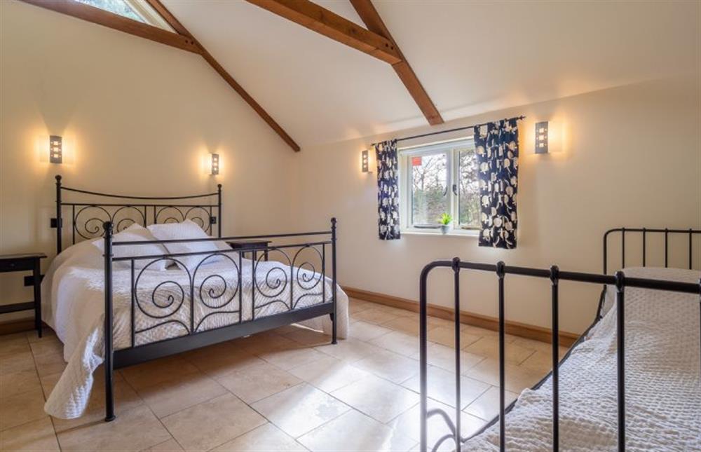 Master bedroom with 5’ king-size bed and 3’ single day bed at Moles Meadow, Middleton 