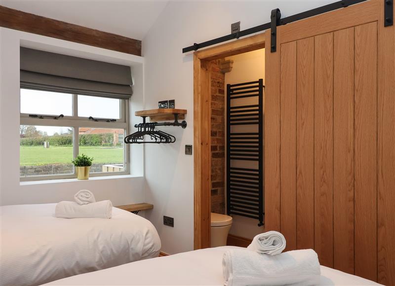 A bedroom in Molly's Cottage at Mollys Cottage, East Knapton near Rillington