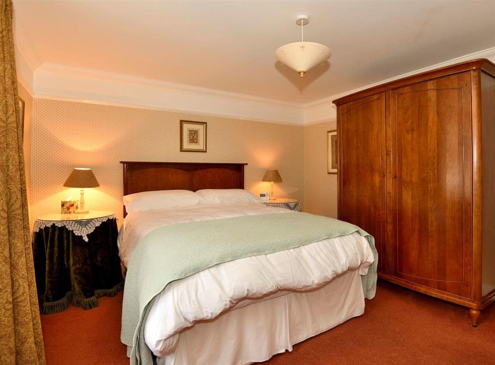 Master Bedroom with king size bed at Mollys Cottage in Penrith, Cumbria