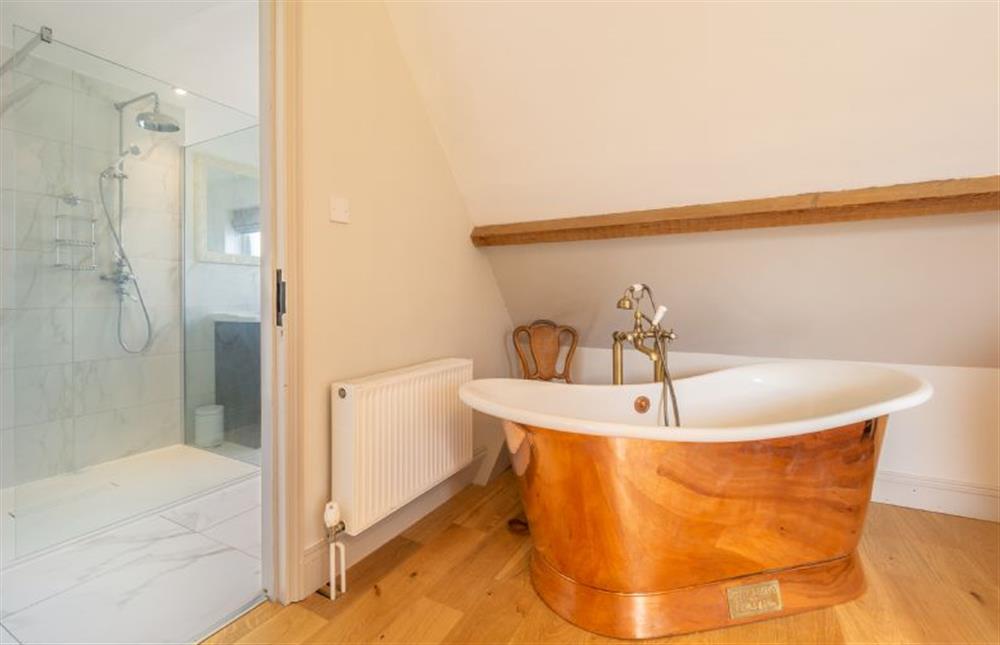 First floor: Copper stand alone bath in the master bedroom at Monkey Puzzle Cottage, Snettisham near Kings Lynn