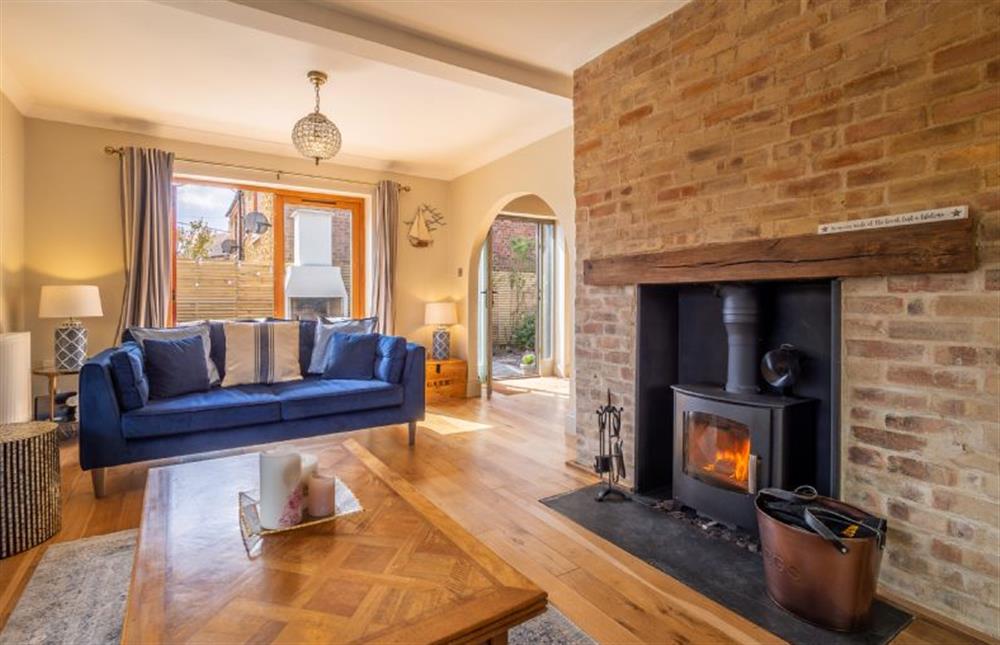 Ground floor: Comfortable seating and wood burning stove at Monkey Puzzle Cottage, Snettisham near Kings Lynn
