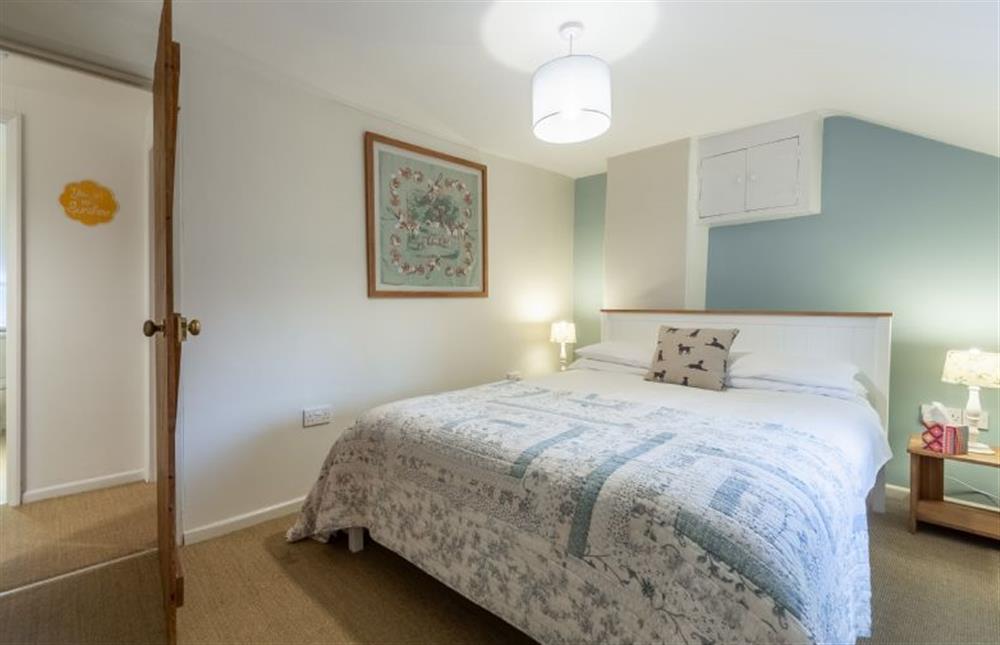 First floor:  Master bedroom is warm and inviting at Montgomery Cottage, Docking near Kings Lynn