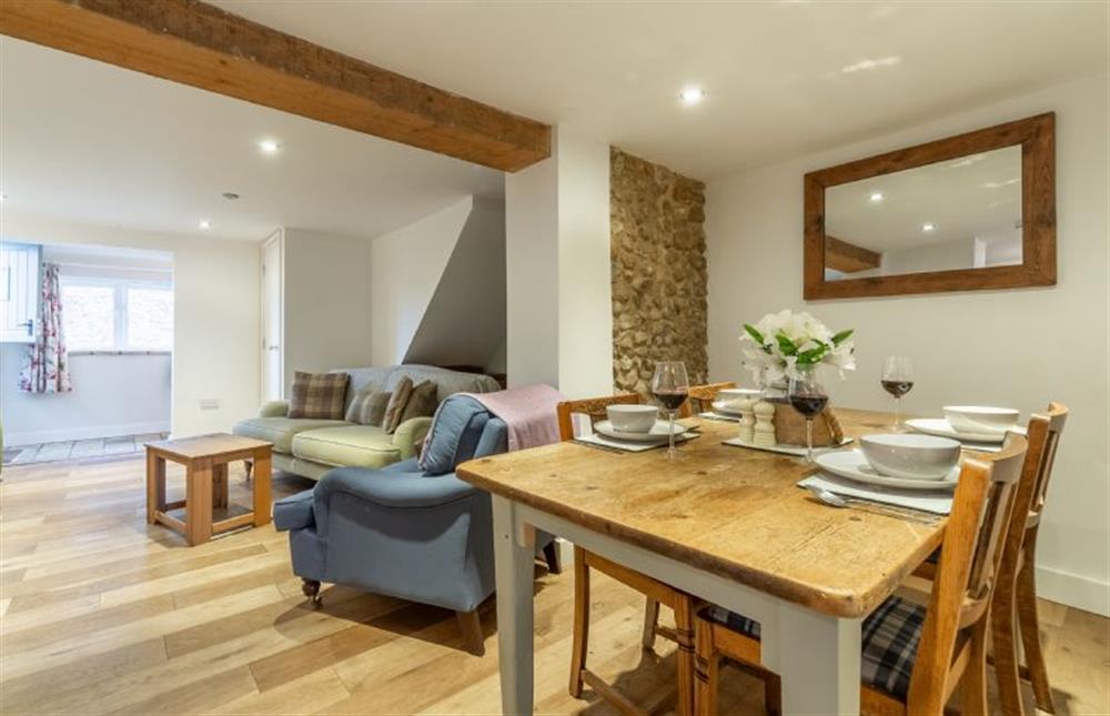 Ground floor: Open-plan sitting/dining area with table and six chairs at Montgomery Cottage, Docking near Kings Lynn