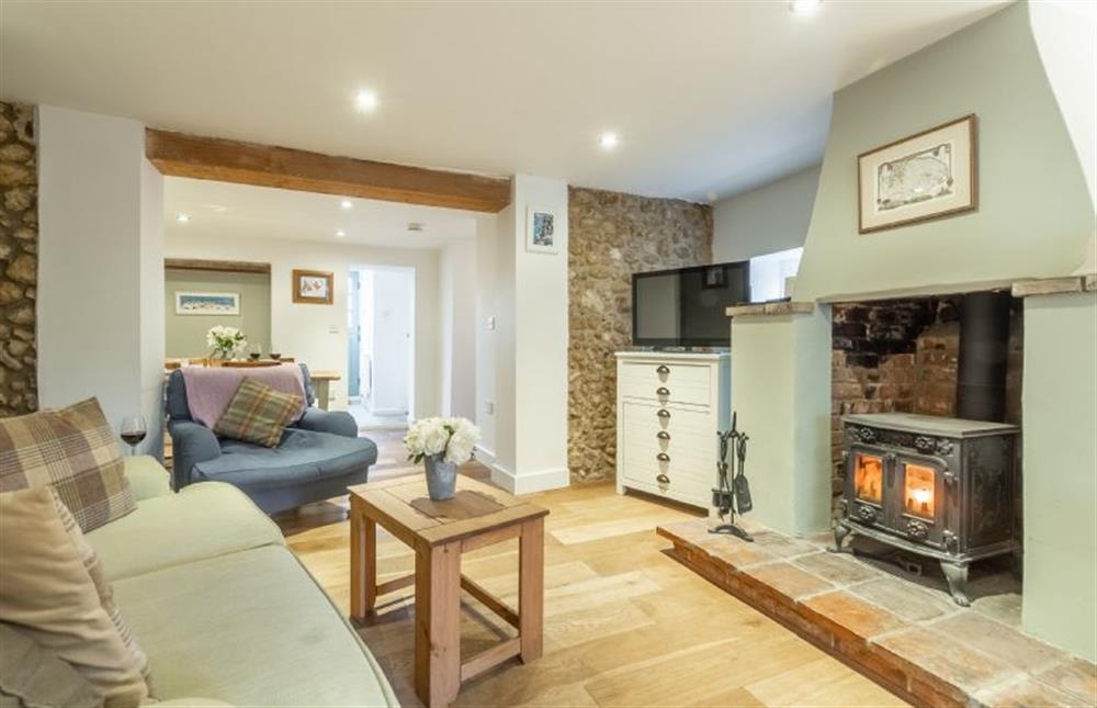Ground floor: Sitting room with wood burning stove at Montgomery Cottage, Docking near Kings Lynn