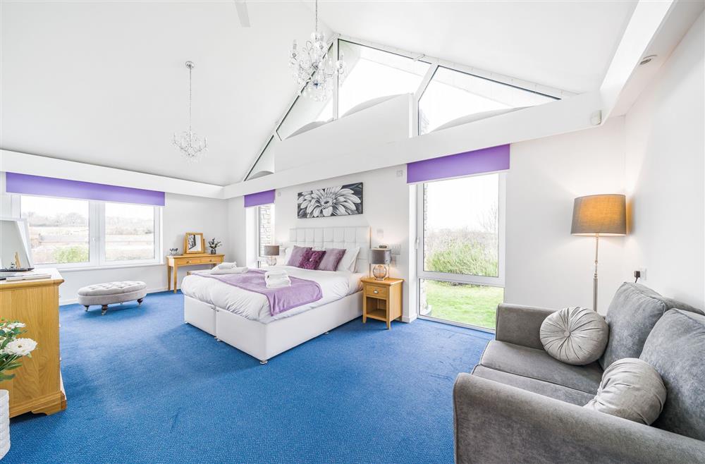 Bedroom one on the first floor with a 6’ super-king size bed  at Monymusk House, Dorchester