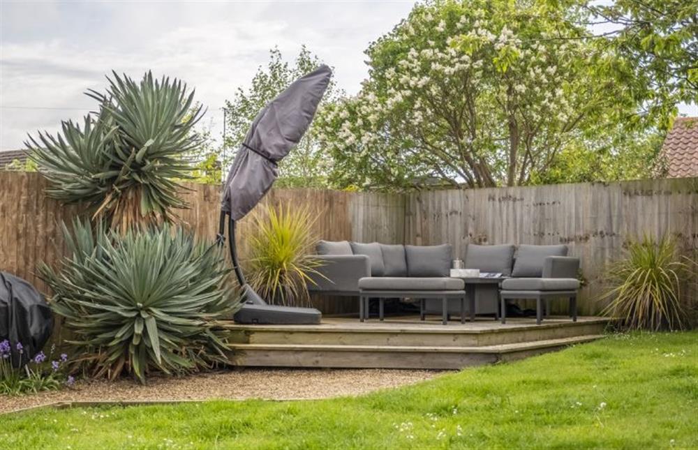 Enclosed garden with seating area, ideal for a coffee or sundowner at Moodie Cottage, Burnham Market near Kings Lynn