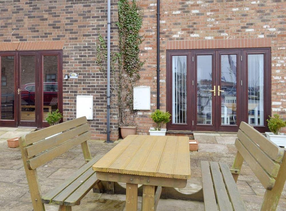Patio with outdoor furniture at Moon River Cottage in Whitby, North Yorkshire