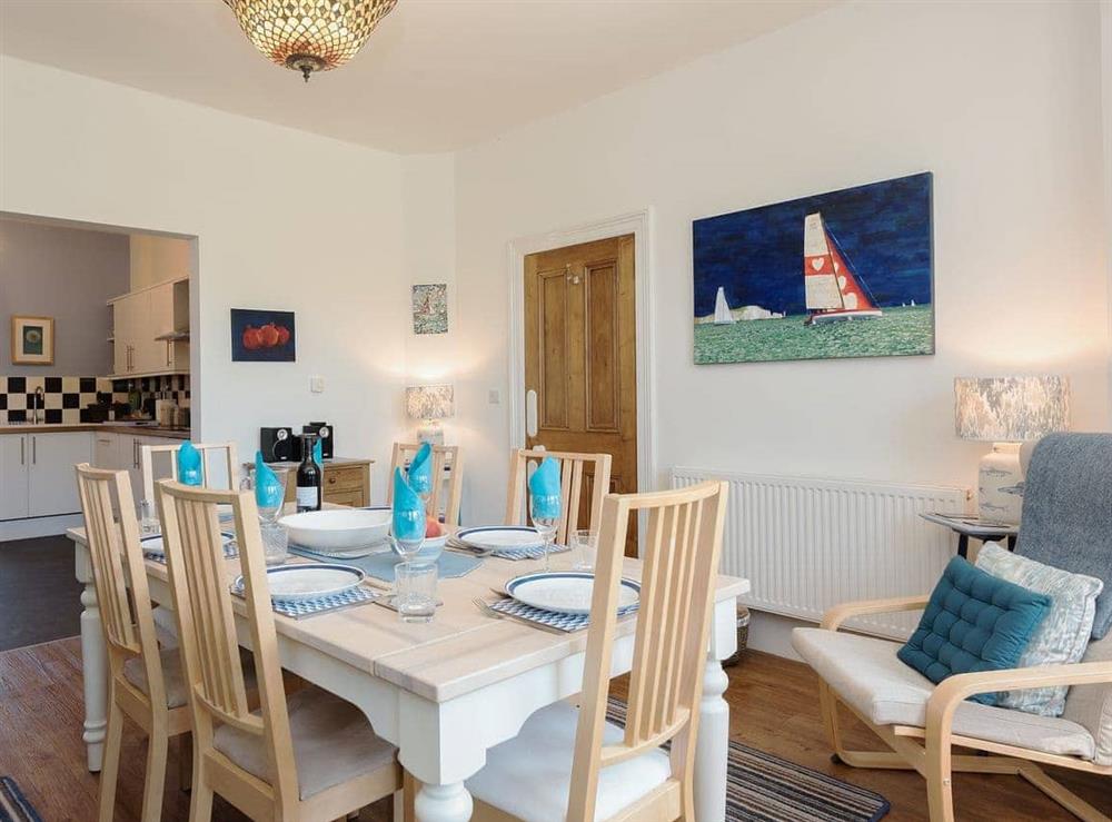 Wonderful dining room leading into the kitchen at Moonbeam House in Freshwater Bay, Isle of Wight