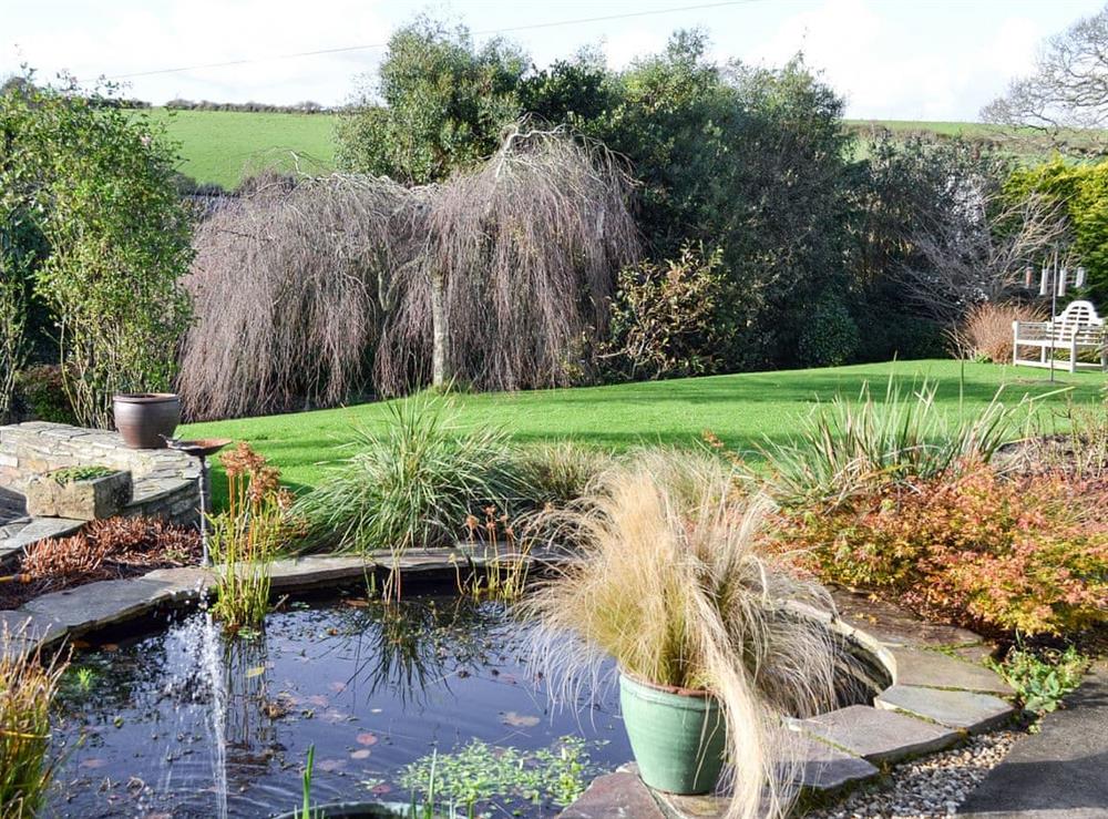 Garden with pond at Moonrakers in Ruan Lanihorne, near Truro, Cornwall
