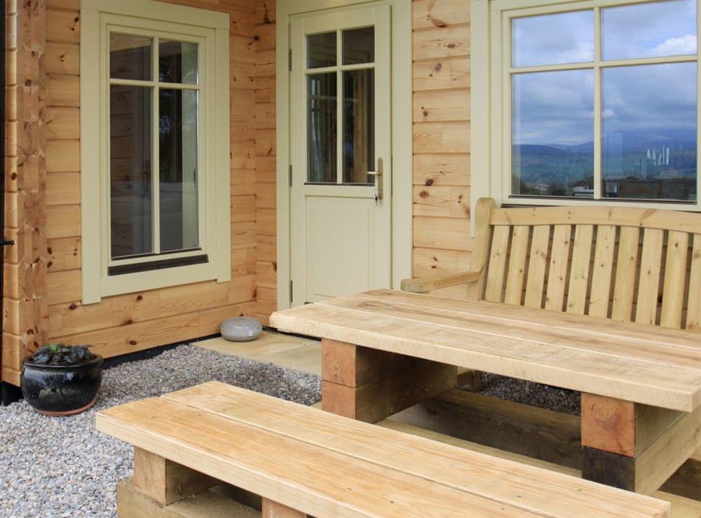 Outdoor furniture at the main entrance at Moonshine Cottage in Culbokie, near Dingwall, Ross-Shire